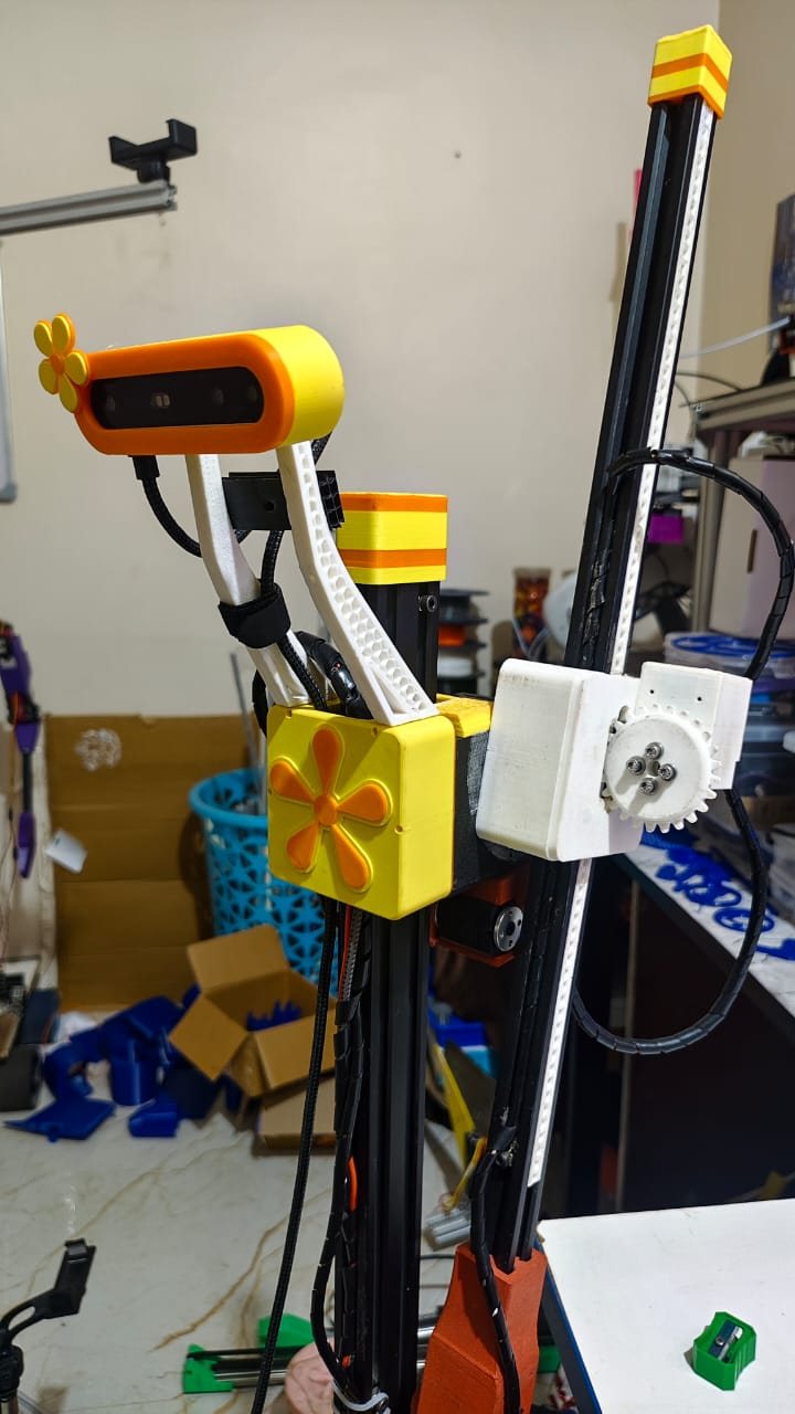 Side view of the rig showing the depth camera on white struts and a geared carriage on the vertical rail